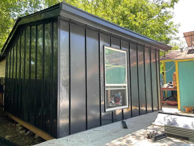 Black standing seam metal wall panels for Metal Roof Installation in University