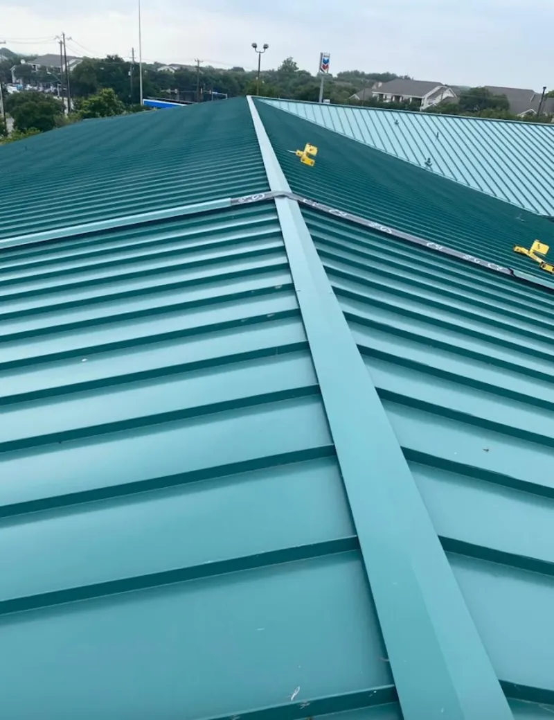 Green commercial metal roof ridge and valley for Metal Roof Repair in University